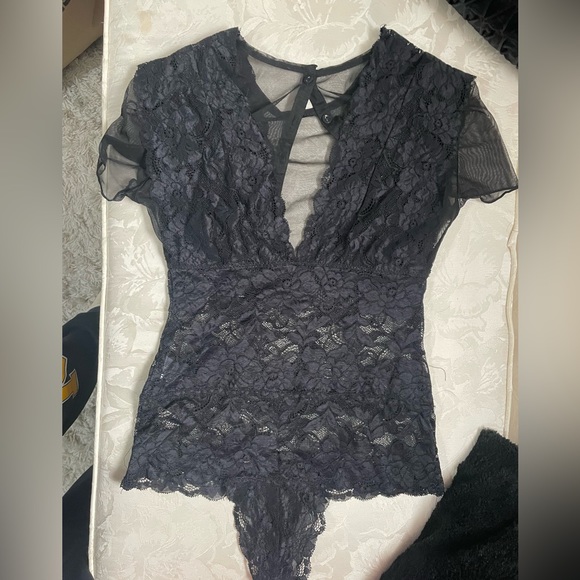 Lacey black short sleeve body suit with mesh deep V. It has four buttons in back - Picture 3 of 4